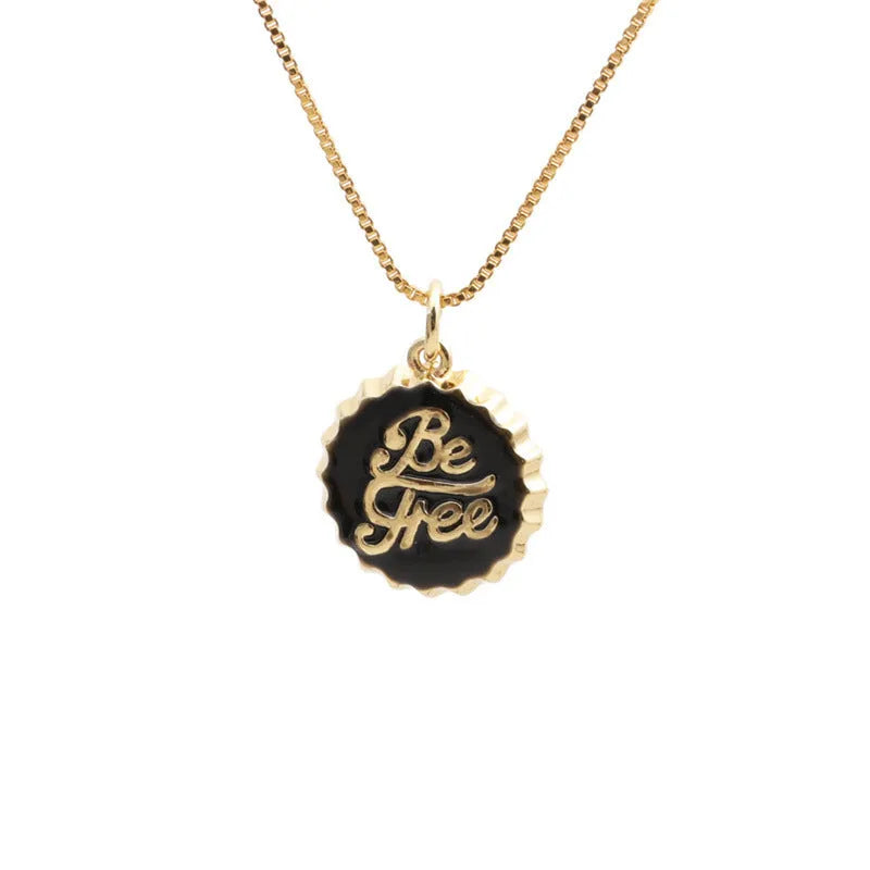Copper bottle cap pendant necklace with gold plating on a box chain.
