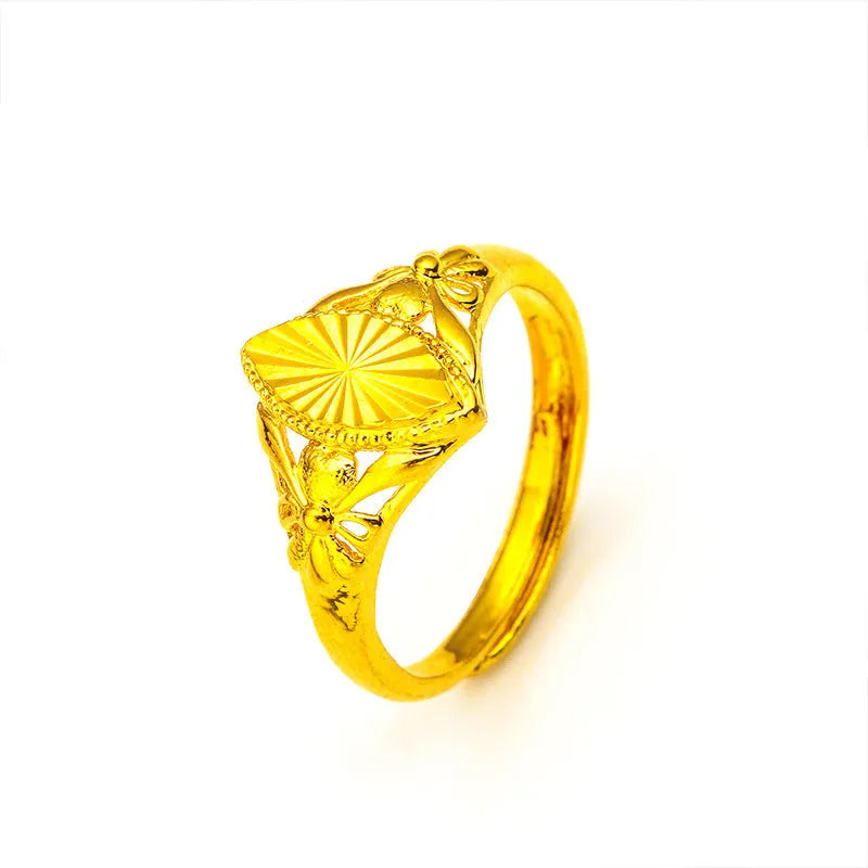 Gold electroplated brass flower ring with open geometric design and textured alluvial pattern