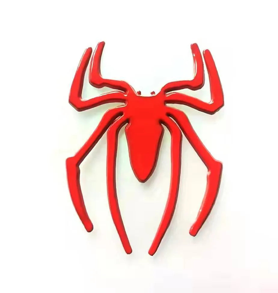 Three-dimensional metal spider bumper sticker in zinc alloy, shown in gold colour.