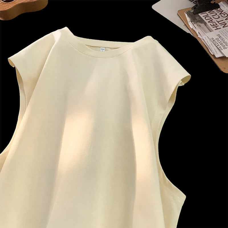 Men's loose solid colour cotton tank top on hanger showing straight hem design