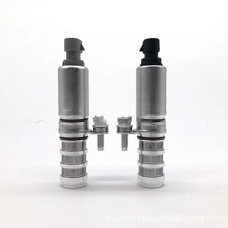 Pair of oil control VVT solenoid valves for Buick and Chevrolet vehicles on a white background.