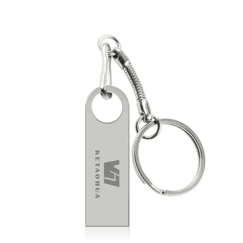 Silver metal car-shaped USB flash drive showing USB connector and compact size.
