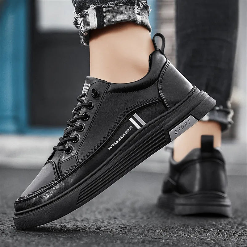 Men's white and black low-top skate shoes with elastic band and microfiber upper.
