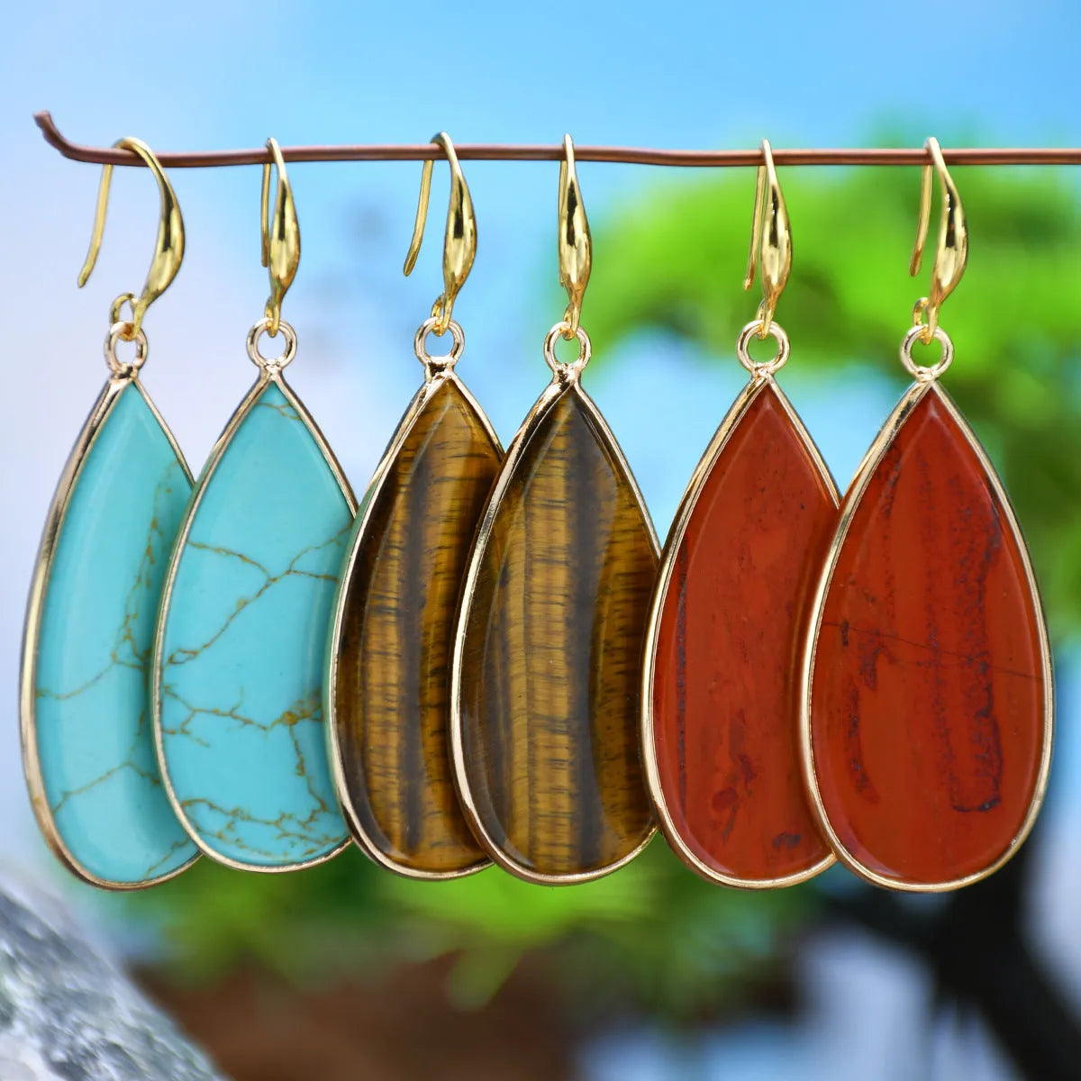 Vintage handmade stone drop earrings with water droplet shape in five colour options including tigereye and amethyst