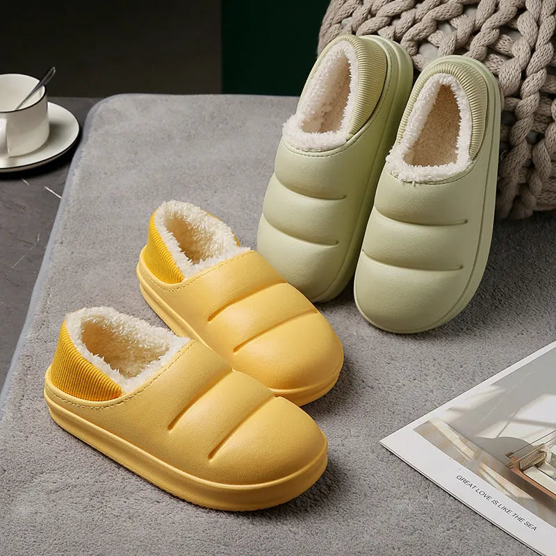 Women's green waterproof EVA winter slippers with plush lining and a non-slip sole.