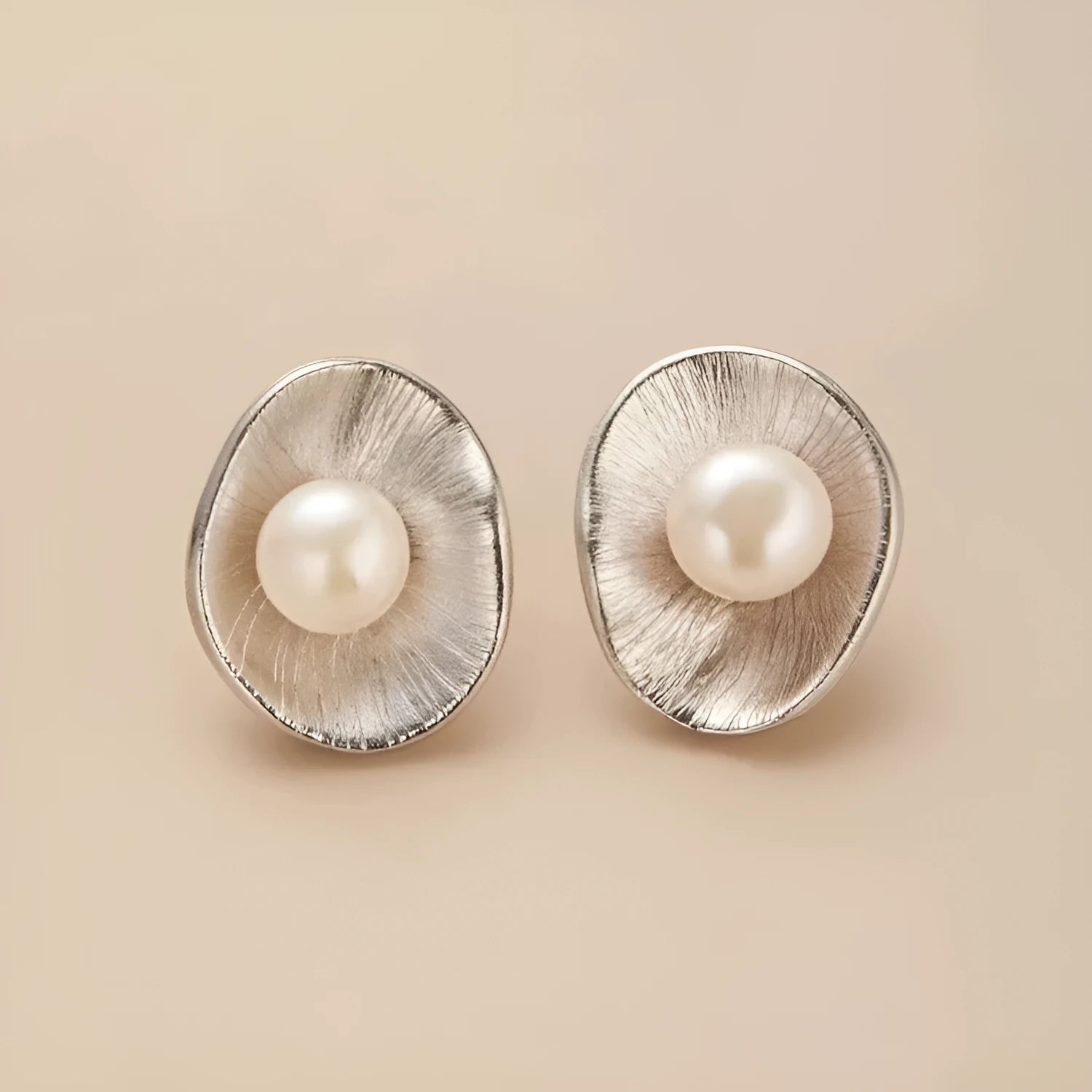 Pearl sterling silver needle earrings with electroplated gold finish geometric design
