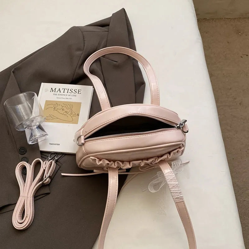 Women's casual PU shoulder handbag with a bandage bow and phone compartment in multiple colour options.