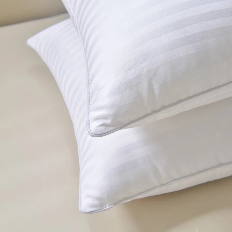 White cotton satin stripe pillow with feather cotton fill showing three size options