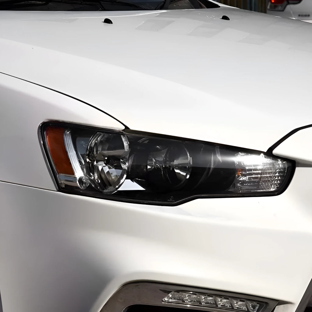 Transparent plastic vehicle headlight housing cover showing dimensions.