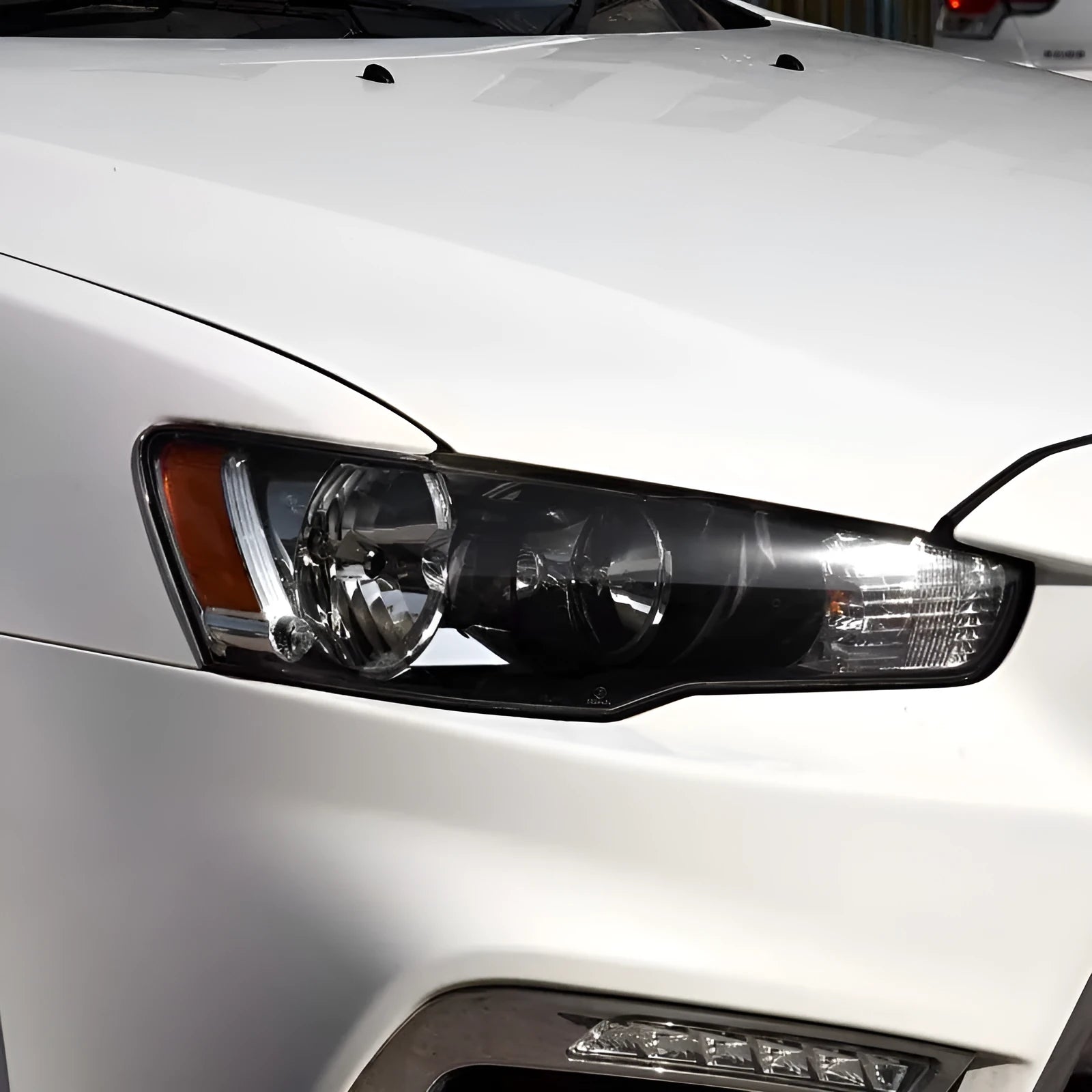 Transparent plastic vehicle headlight housing cover showing dimensions.
