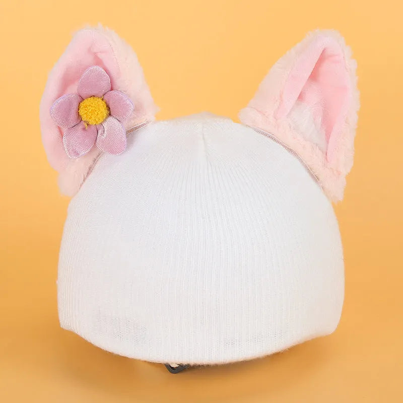 A plush fabric helmet cover with cartoon character ears, shown in size M for bicycle or motorbike use.
