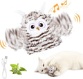 Grey automatic chirping owl cat toy with beating wings on a floor.