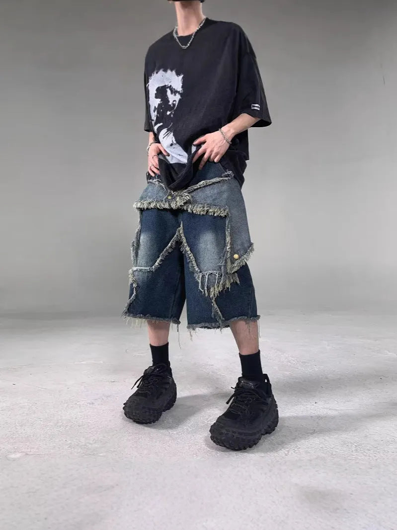 Blue men's denim shorts with a frayed hem and a large five-pointed star design on the leg.