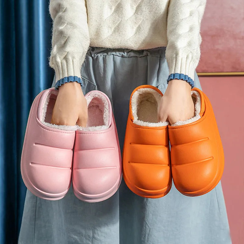 Women's green waterproof EVA winter slippers with plush lining and a non-slip sole.